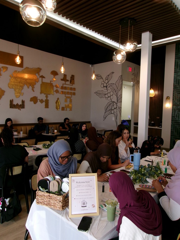 Women decorating grip socks at a Studio Ivayah creative workshop
